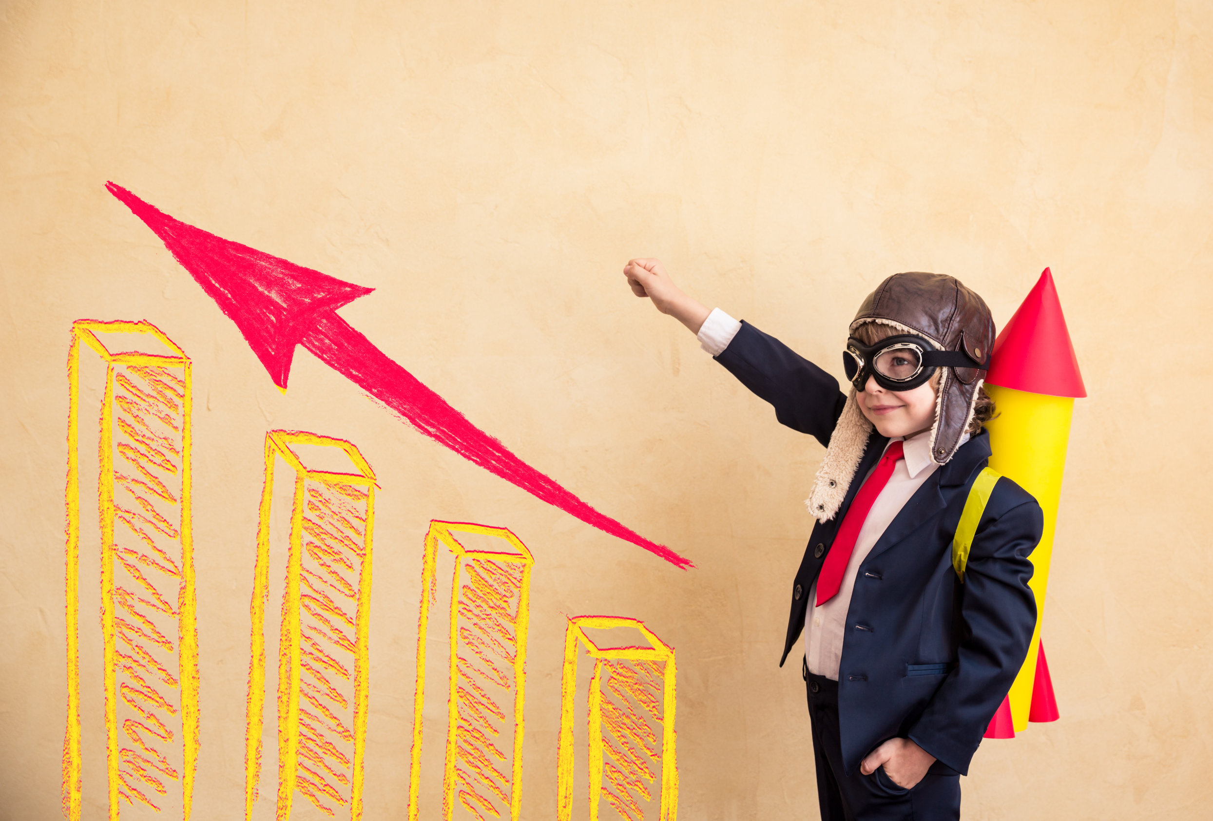 Portrait Of Young Businessman With Paper Rocket. Success, Creative And Startup Concept. Copy Space For Your Text